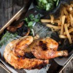 Half roast chicken is a classic Oktoberfest offering and beer garden menu item. Juicy meat, crispy skin, served with fries and Gurkensalat.